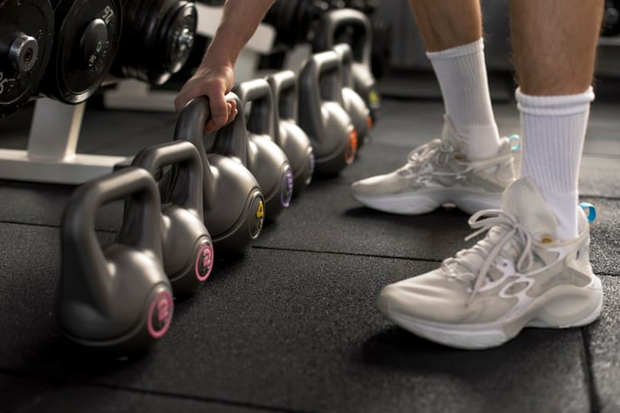 close-up-hand-holding-kettlebell