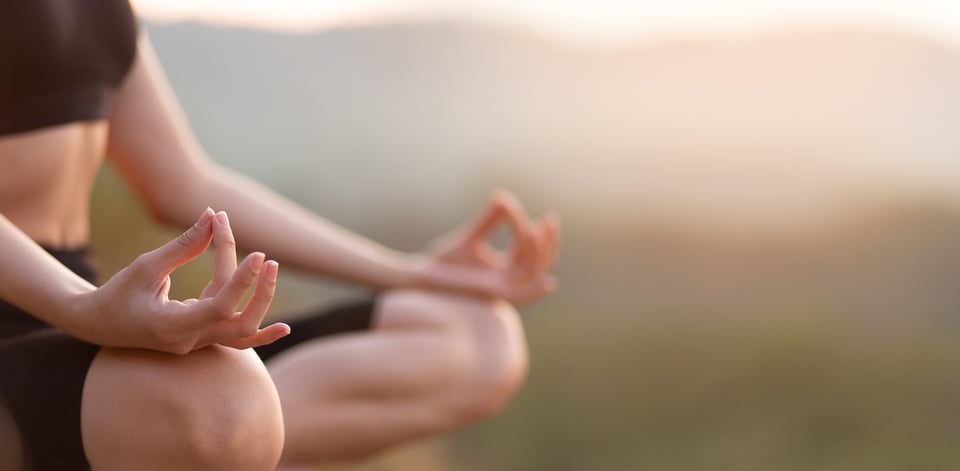 selective-focus-hands-woman-sit-yoga-lotus-pose-outdoor-sunrise-meditating-balance
